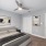Spacious bedroom with ceiling fan - Royal Isles Apartments in Orlando